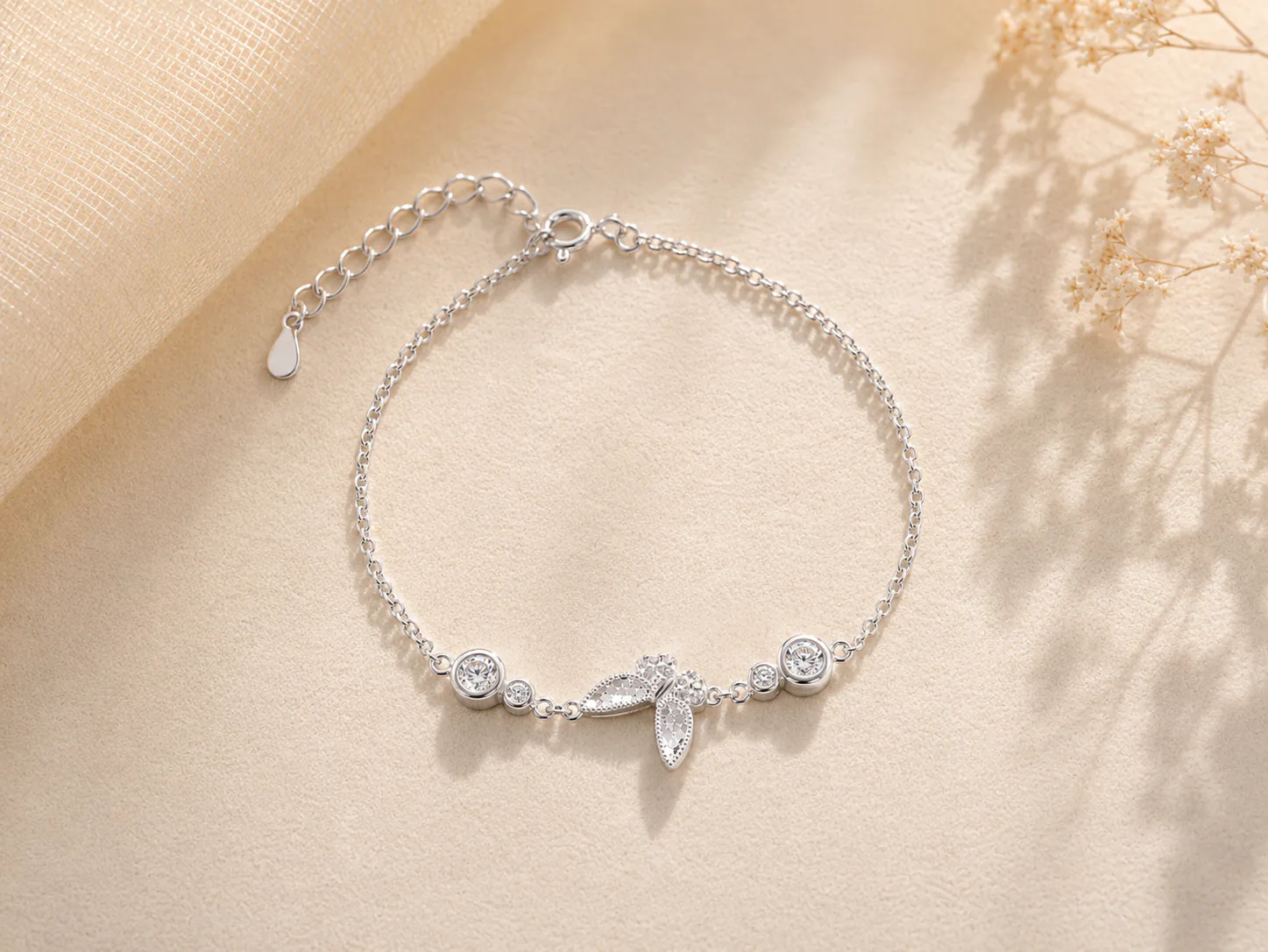 Delicate silver bracelet with butterfly motif and round stones