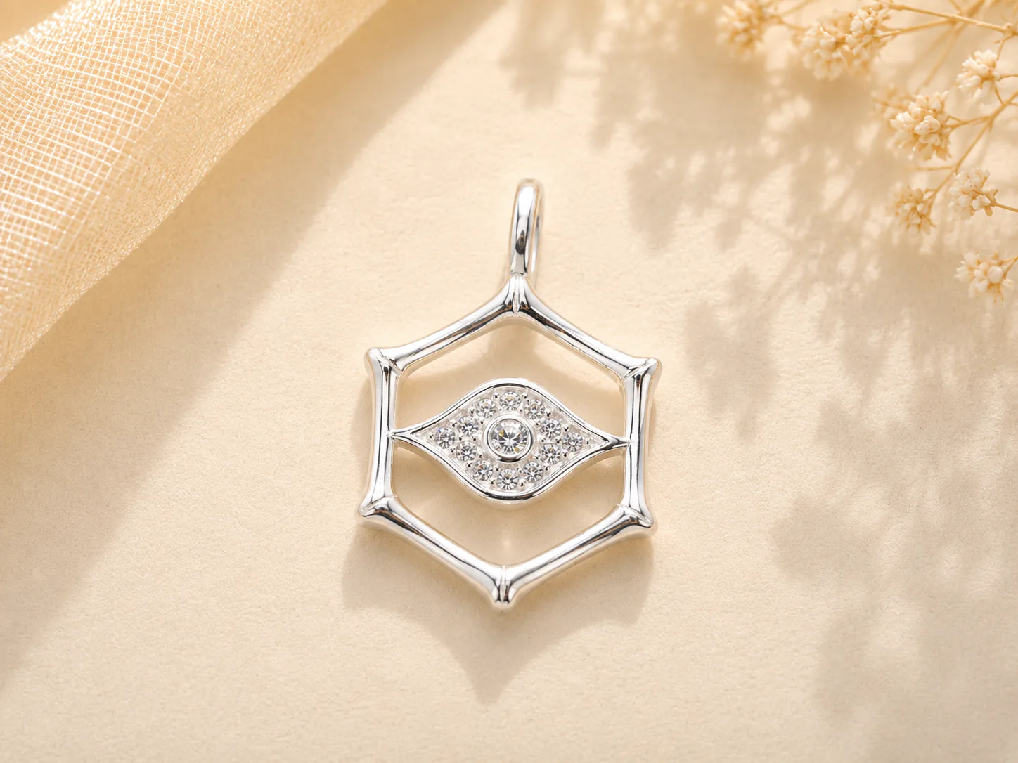 Geometric silver eye pendant with stones