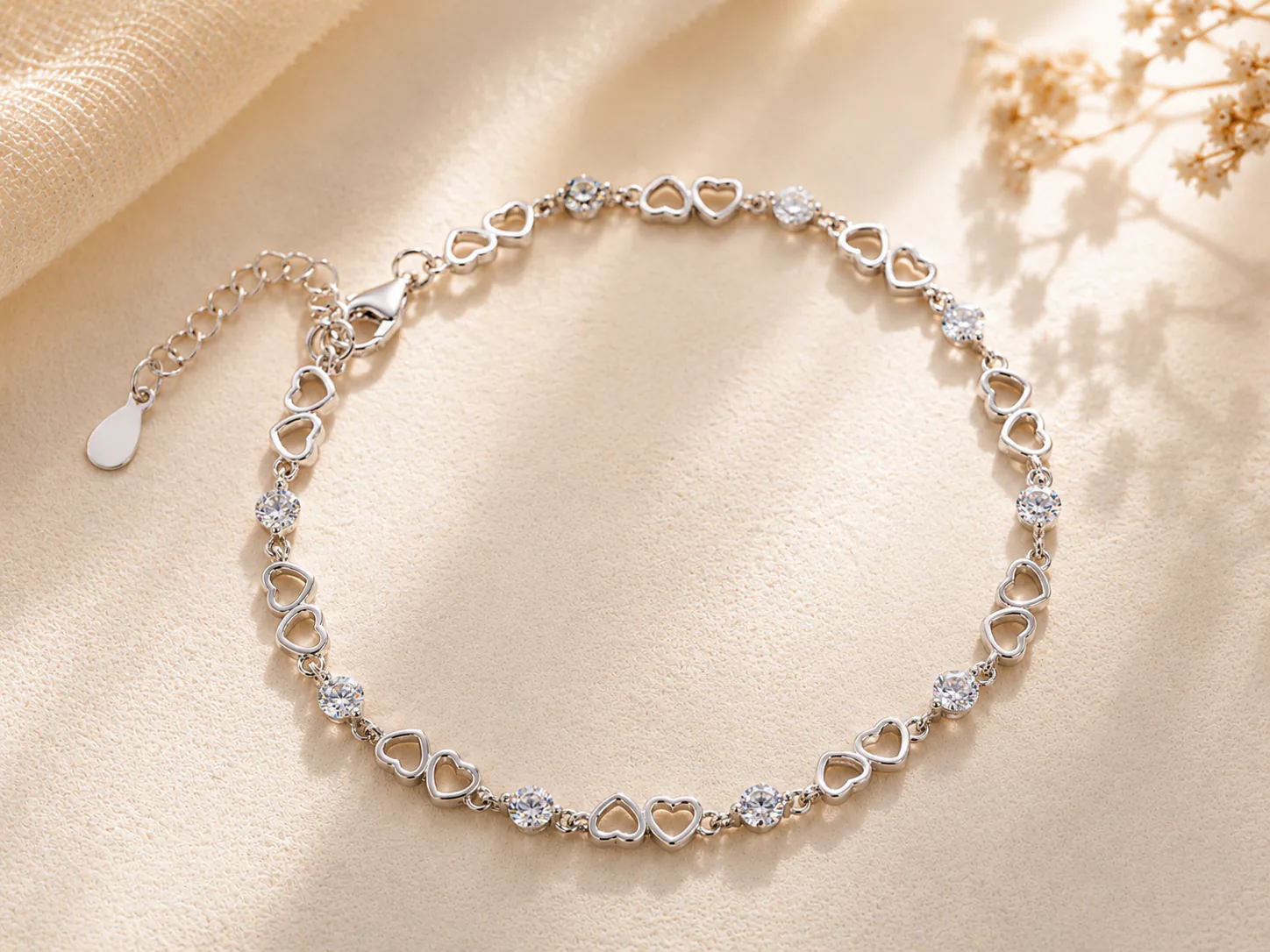 Silver heart link bracelet with round stones