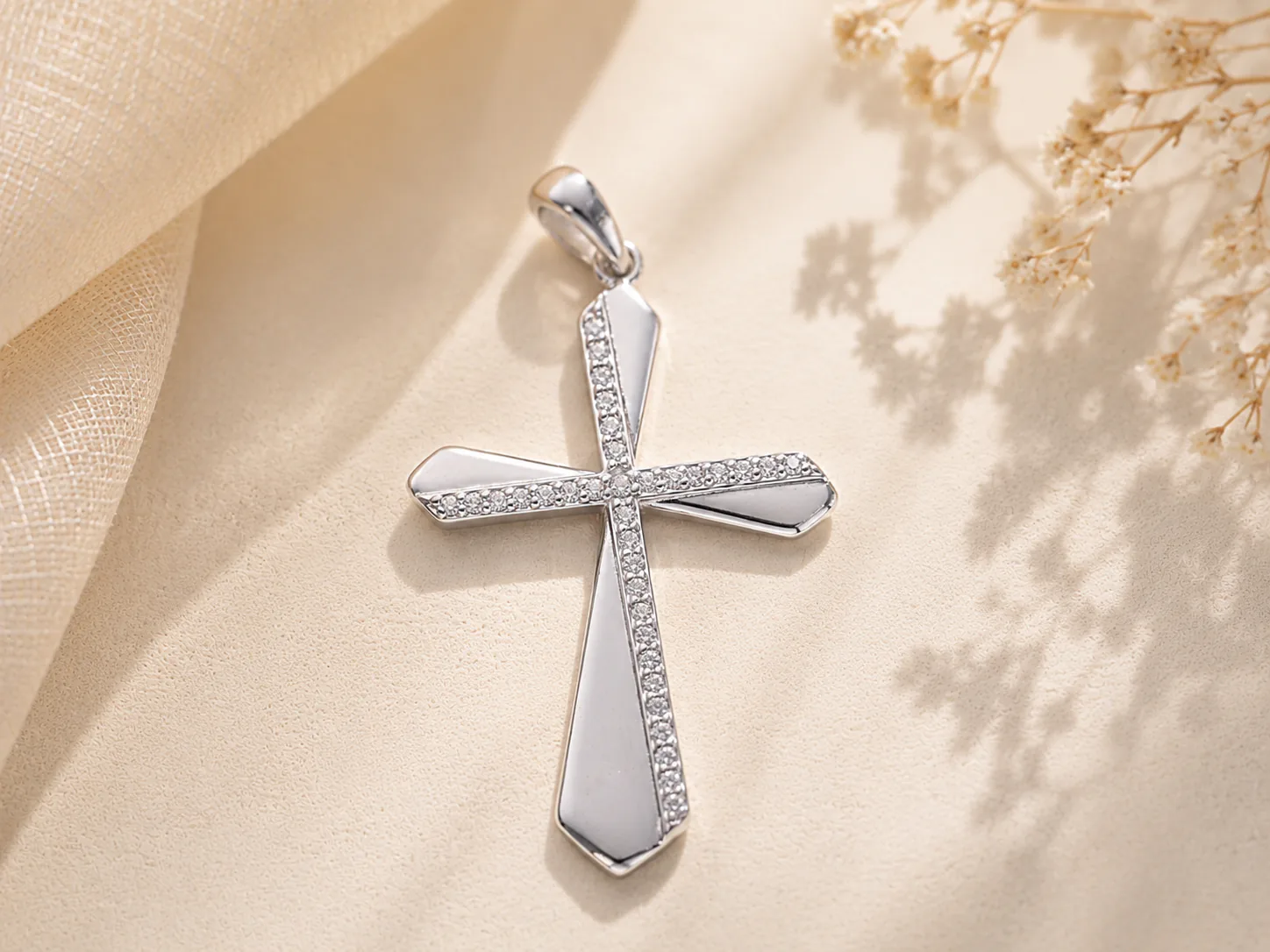 Polished silver cross pendant with pavé accents