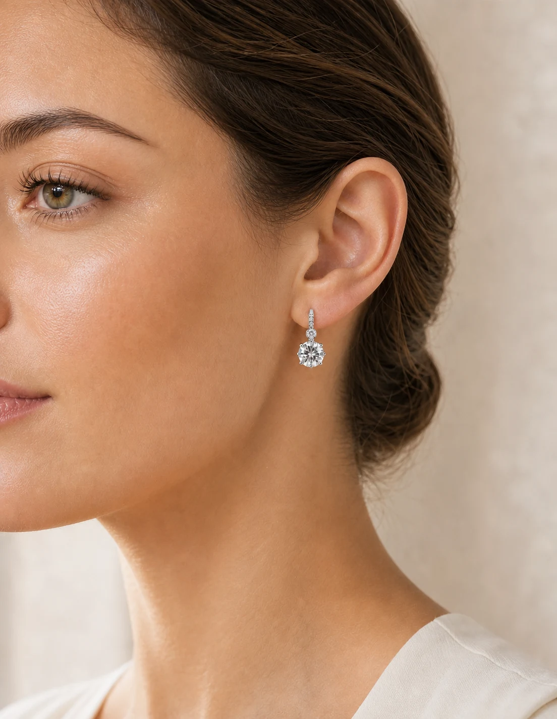 Model wearing a silver drop earring