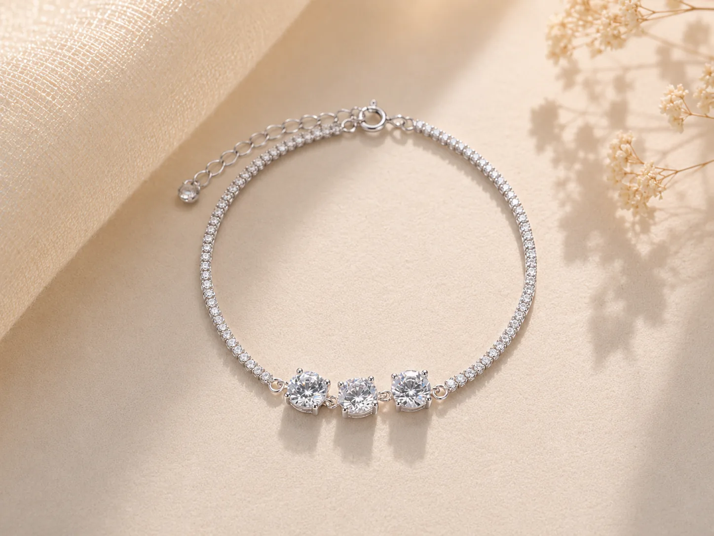 Silver tennis bracelet with three larger center stones