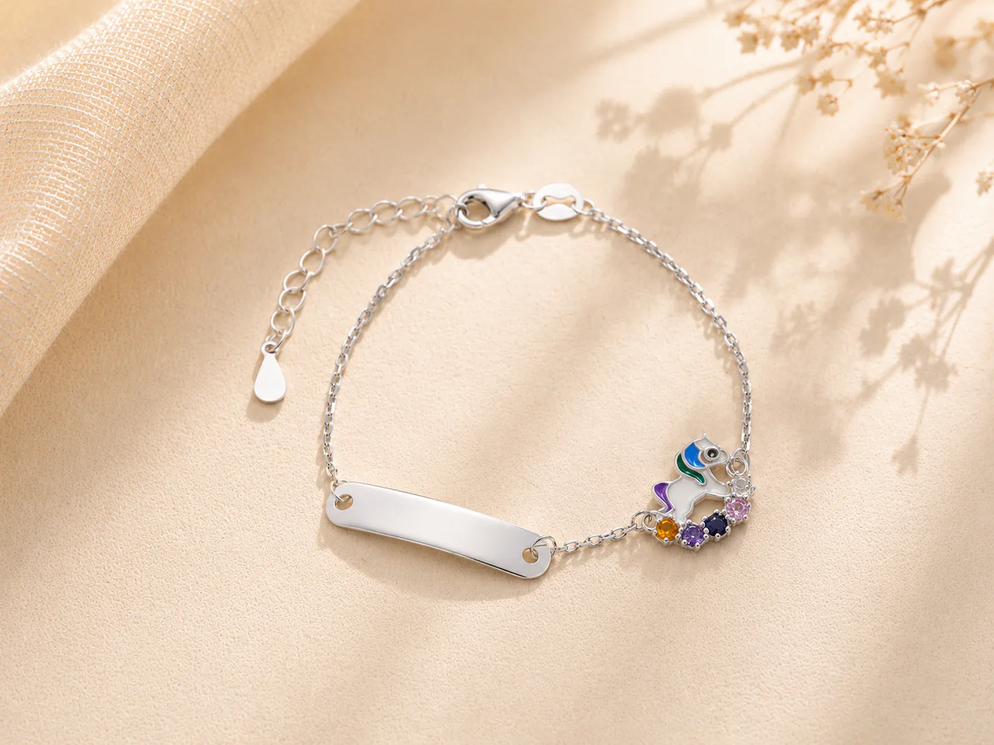 Silver ID bracelet with colorful unicorn charm